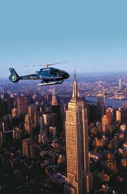 A helicopter flies above New York City