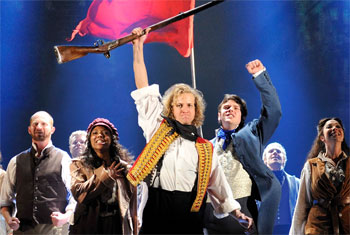 The Broadway Version of Les Miserables waving red flag at Les Miserables 2014 on Broadway