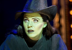 Actress Rachel Tucker in green makeup and black witch hat