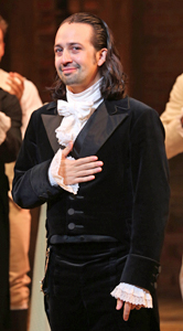 Lin-Manuel Miranda in black and white costume on the Richard Rodgers stage