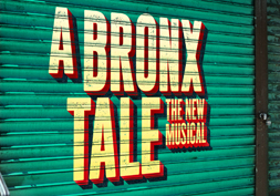 a bronx tale logo green, yellow and orange