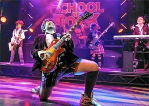 School of Rock Dewey Finn on stage